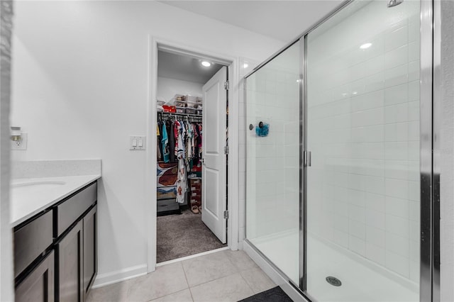 bathroom with vanity, tile patterned floors, and an enclosed shower