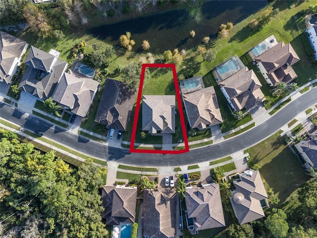 birds eye view of property with a residential view