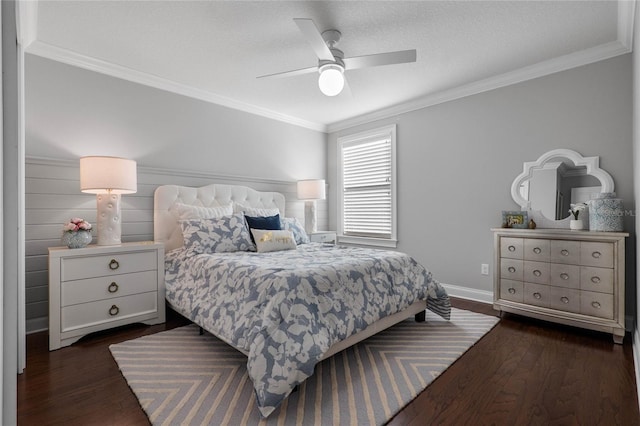 bedroom featuring a ceiling fan, baseboards, ornamental molding, and dark wood-style flooring