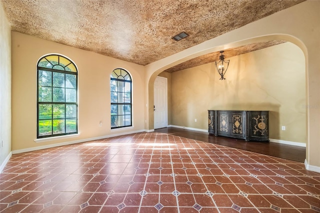 interior space featuring a textured ceiling