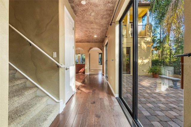 corridor featuring dark hardwood / wood-style flooring