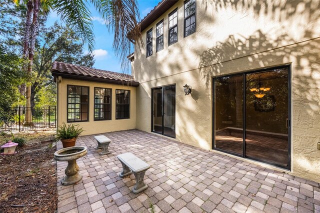 rear view of property featuring a patio