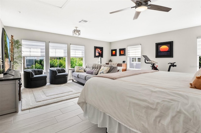 bedroom featuring light wood-type flooring and ceiling fan