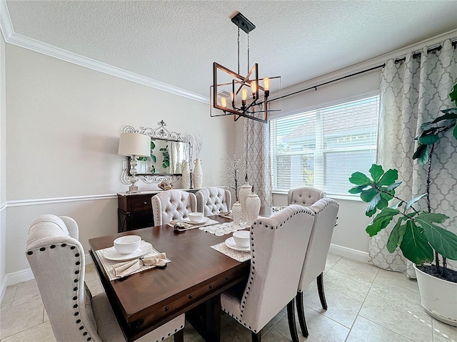 dining area featuring an inviting chandelier, ornamental molding, light tile patterned floors, and a textured ceiling