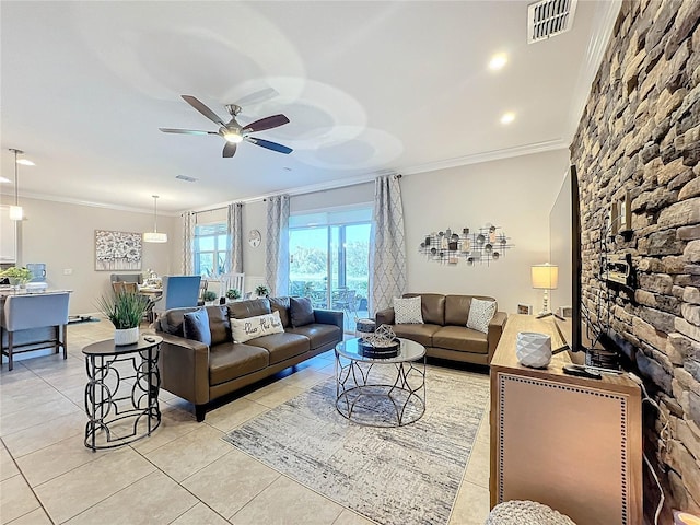 living room with light tile patterned floors, ceiling fan, and ornamental molding