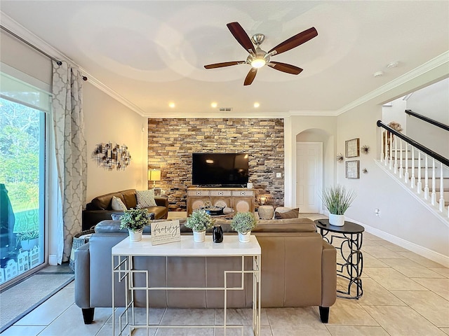 living room featuring ceiling fan, ornamental molding, and light tile patterned flooring