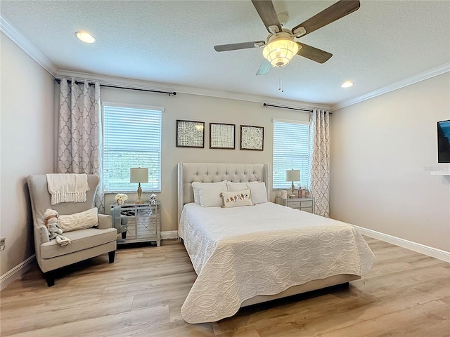 bedroom with crown molding, light hardwood / wood-style floors, a textured ceiling, and ceiling fan