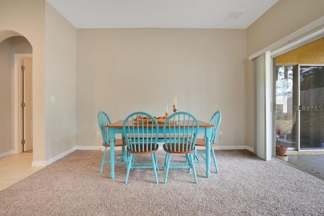 dining room with light carpet