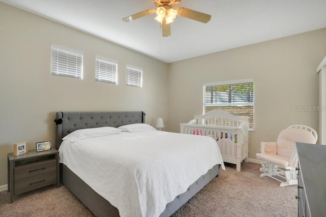 carpeted bedroom with ceiling fan