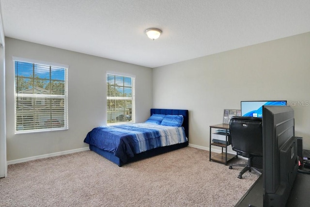 carpeted bedroom with a textured ceiling