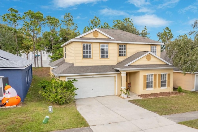 view of front of home featuring a front yard and a garage