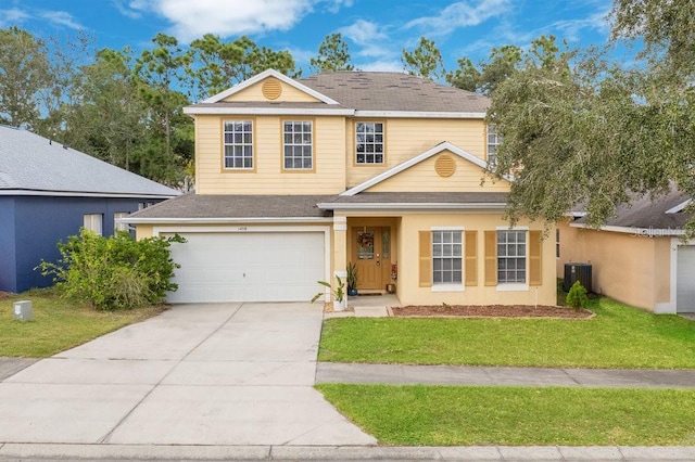 front of property with central air condition unit and a front yard