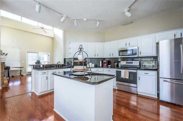 kitchen featuring white cabinetry and appliances with stainless steel finishes