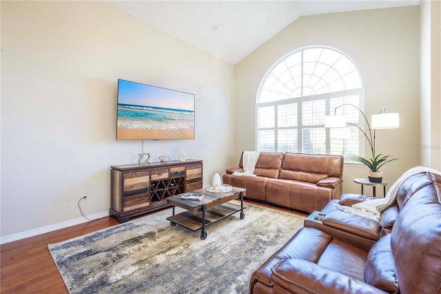 living room featuring lofted ceiling and dark hardwood / wood-style floors