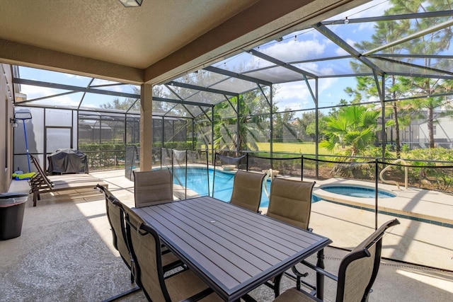 5295 Wildwood Way, Davenport, FL 33837 - view of patio featuring an in-ground hot tub, an outdoor pool, glass enclosure, and outdoor dining space