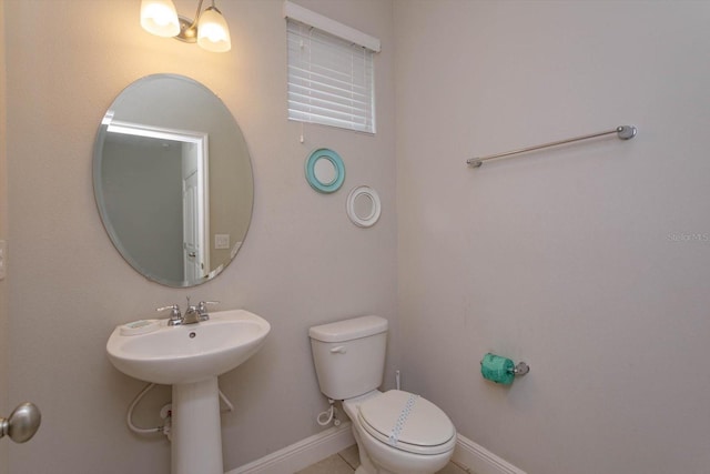 5295 Wildwood Way, Davenport, FL 33837 - bathroom featuring toilet and baseboards