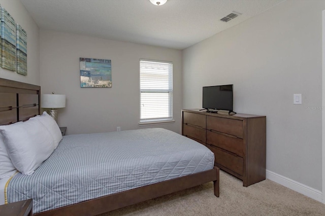 5295 Wildwood Way, Davenport, FL 33837 - bedroom featuring light colored carpet and baseboards