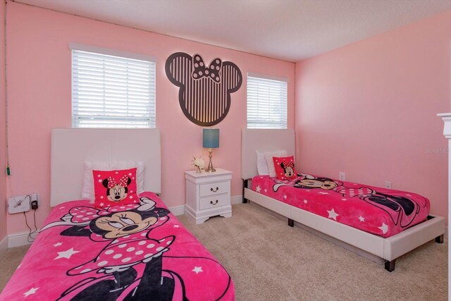 5295 Wildwood Way, Davenport, FL 33837 - bedroom featuring carpet floors and baseboards