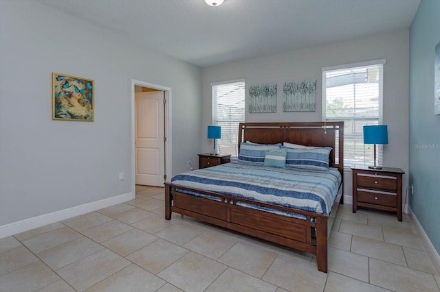 5295 Wildwood Way, Davenport, FL 33837 - bedroom featuring light tile patterned floors and baseboards