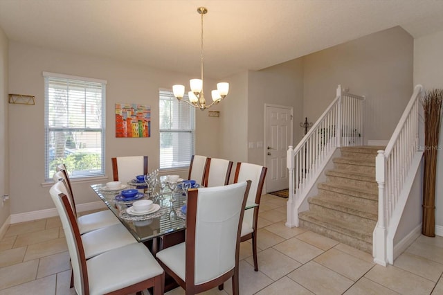 5295 Wildwood Way, Davenport, FL 33837 - dining space with a chandelier, stairs, light tile patterned floors, and baseboards