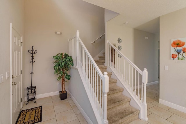 5295 Wildwood Way, Davenport, FL 33837 - stairway featuring tile patterned flooring and baseboards
