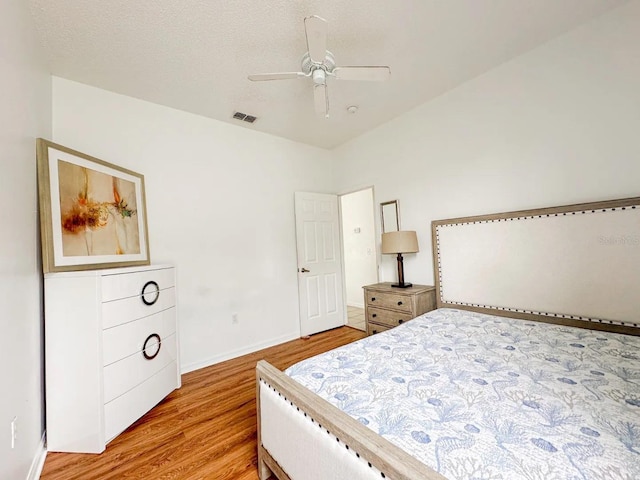 bedroom with light wood-type flooring and ceiling fan