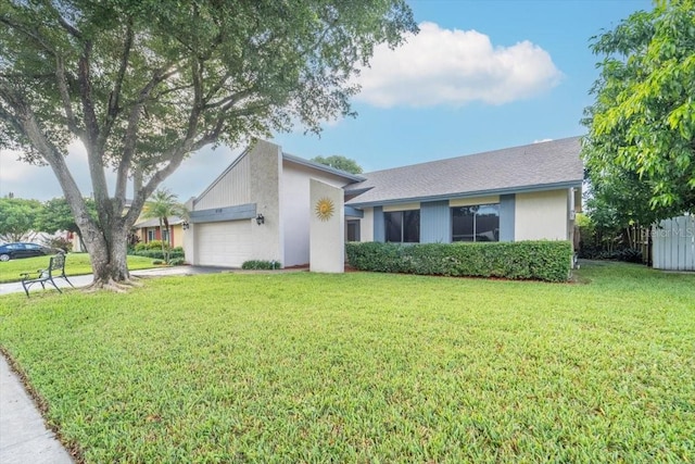 single story home with a front lawn and a garage