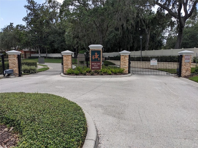 view of gate with fence