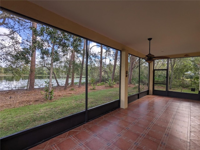 unfurnished sunroom with a water view