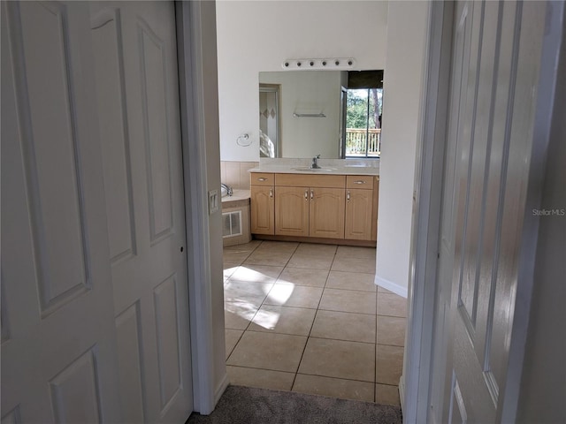 bathroom with visible vents, tile patterned flooring, and vanity