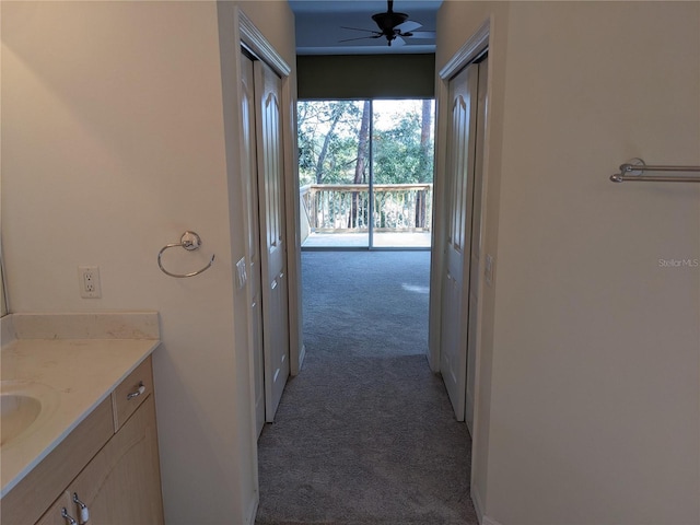 hallway featuring carpet flooring