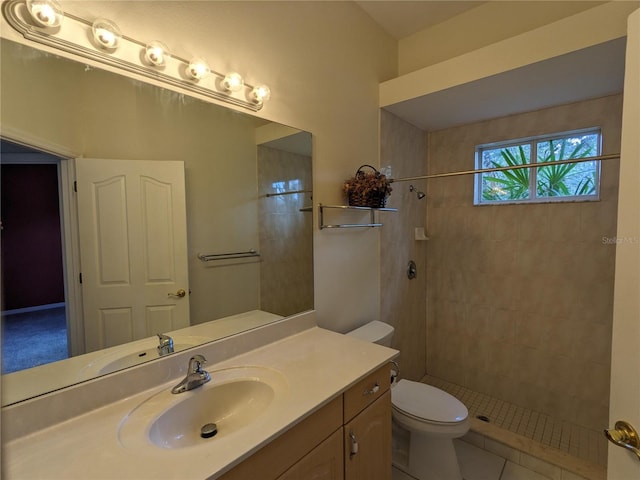 full bathroom featuring tile patterned floors, a shower stall, toilet, and vanity