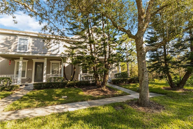 view of front facade featuring a porch and a front yard