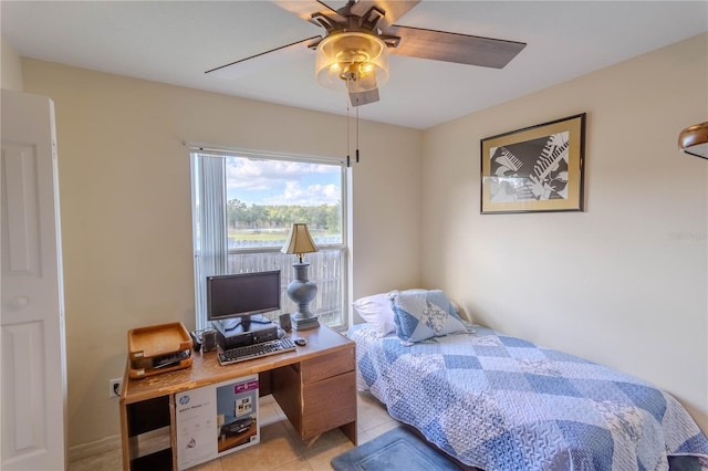 bedroom featuring light tile patterned floors and ceiling fan