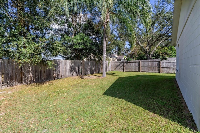 view of yard with a fenced backyard