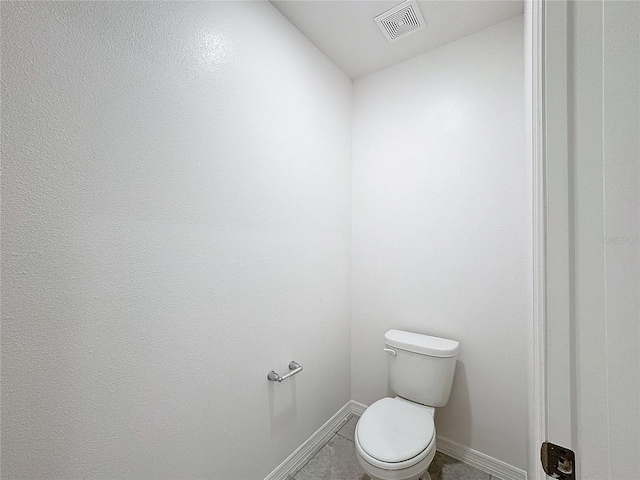 bathroom featuring toilet and tile patterned floors