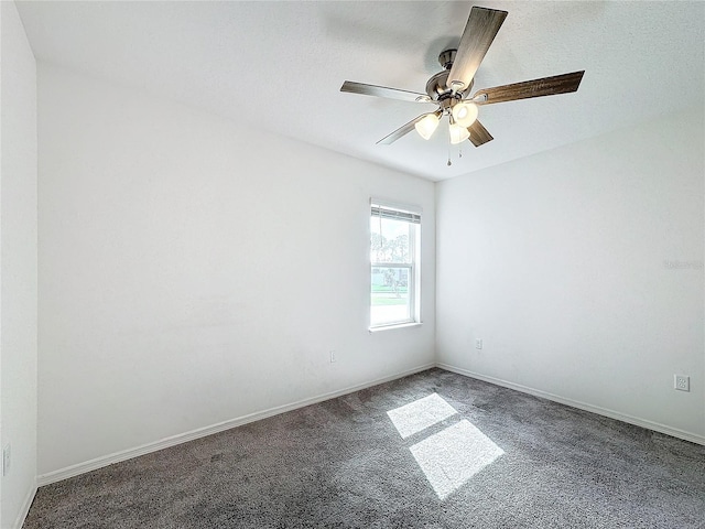 empty room featuring ceiling fan and carpet floors