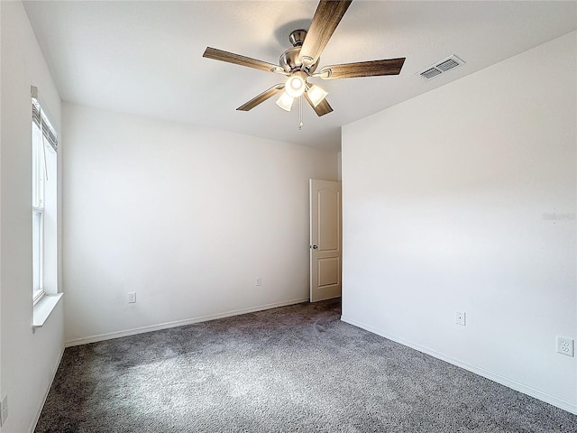 carpeted empty room featuring ceiling fan