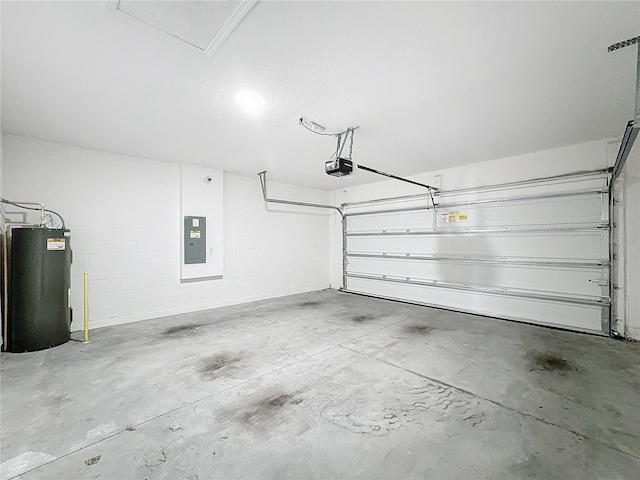 garage featuring water heater, electric panel, and a garage door opener