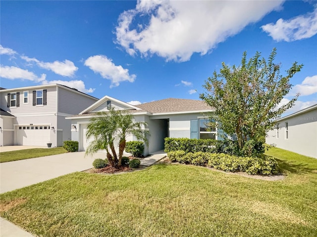 view of front of house with a front lawn and a garage