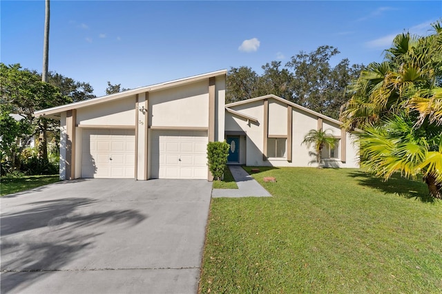 view of front facade with a front yard and a garage