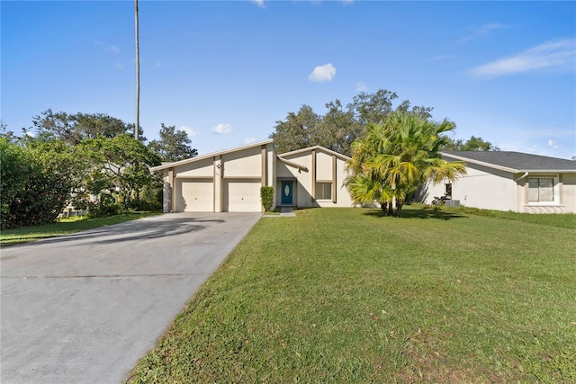 view of front facade featuring a front yard and a garage