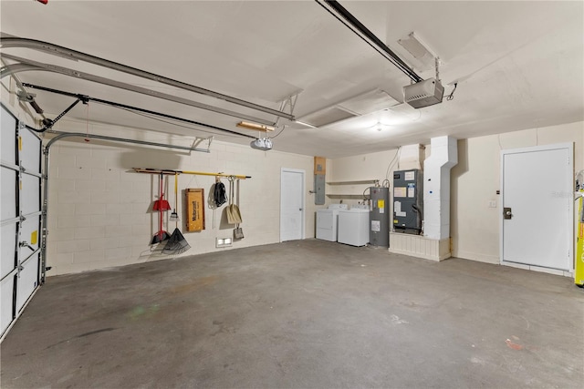 garage with a garage door opener, water heater, washing machine and clothes dryer, heating unit, and electric panel