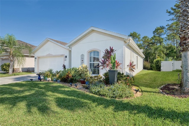 ranch-style home with a front yard and a garage