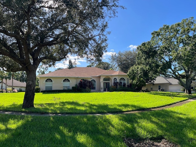 single story home featuring a front yard