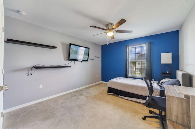 bedroom featuring carpet floors, baseboards, and a ceiling fan