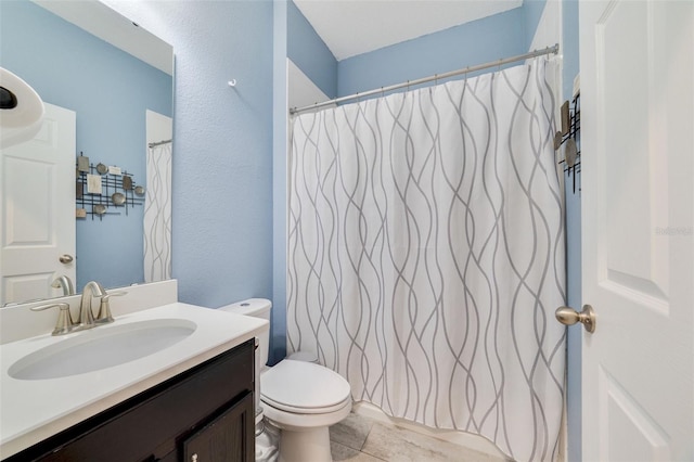 full bath with tile patterned flooring, a shower with shower curtain, vanity, and toilet