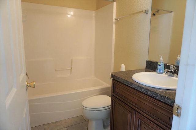 full bathroom with vanity, toilet,  shower combination, and tile patterned flooring