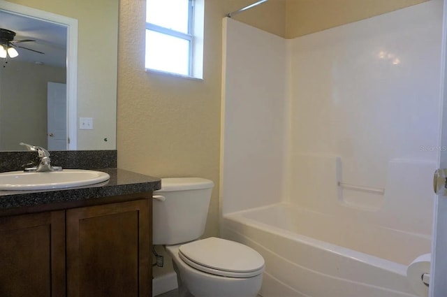 full bathroom featuring vanity, ceiling fan, toilet, and shower / bathtub combination