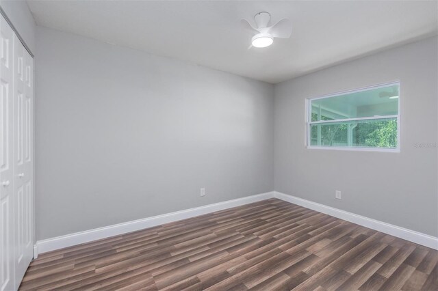 unfurnished room with dark hardwood / wood-style floors